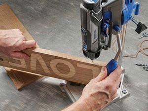 Rotary tool drilling into wood.