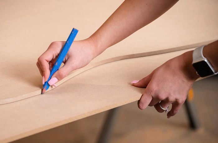 Team Member tracing out backdrop design