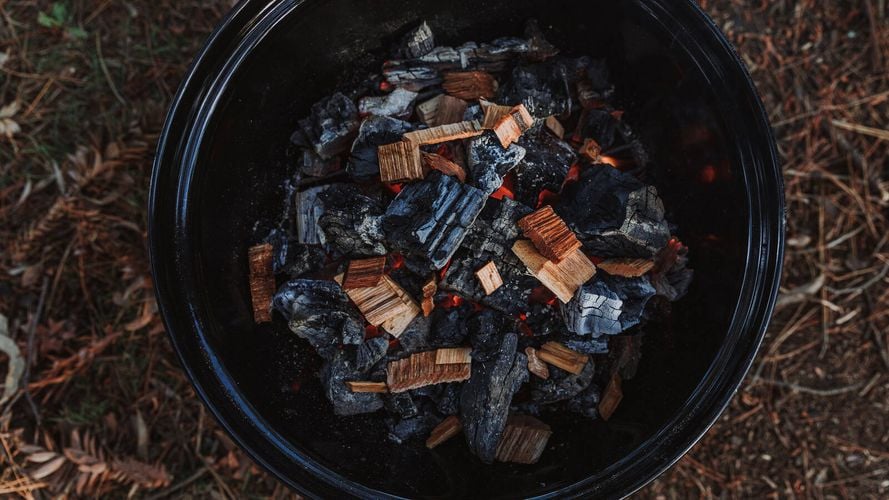 Smoking Chips on top of lit charcoal