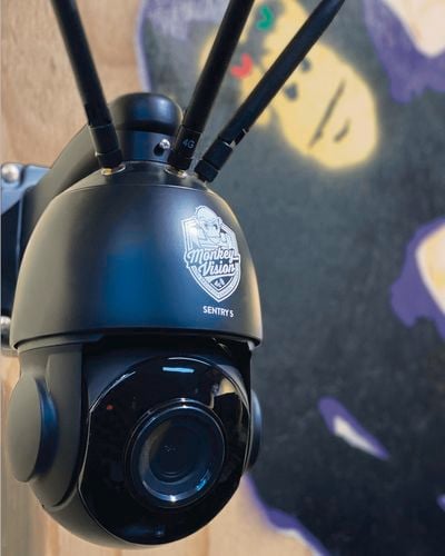 monkey vision sentry camera close up with a visual of a graffiti on the wall