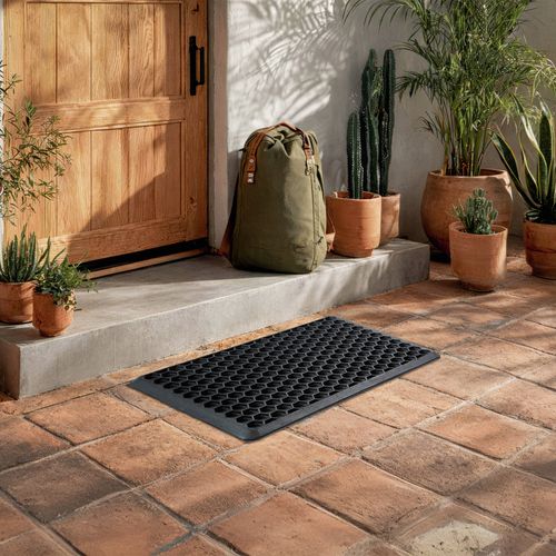 Honeycomb mat design traps sludge, allows water and dirt to be hosed out. Ideal for wet and muddy areas.