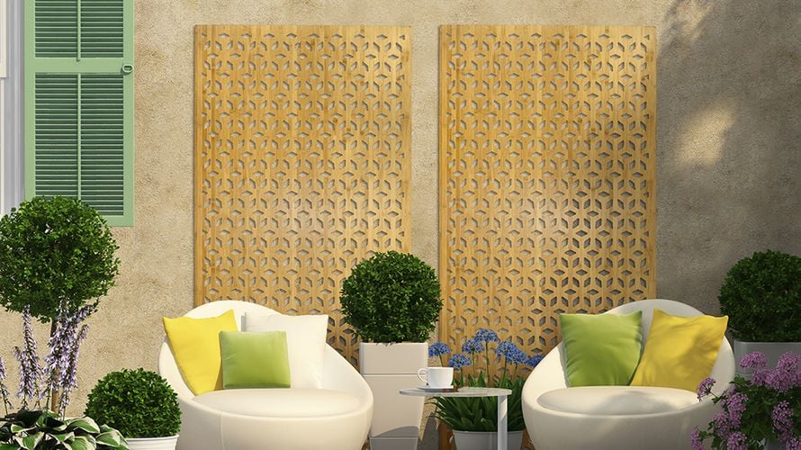 Decorative screens covering a wall in a backyard