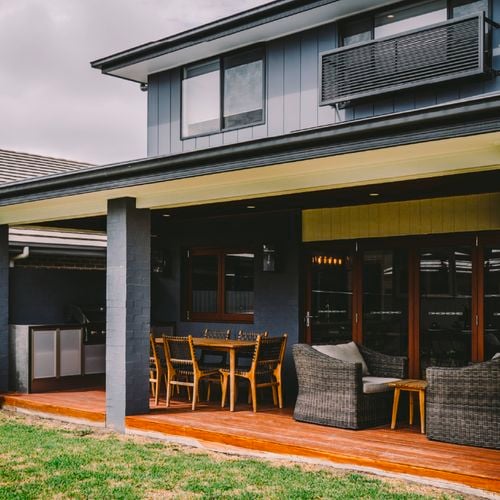 Outdoor entertaining area with timber deck and furniture