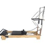The Core Collab The Pilates Reformer With Half Trapeze