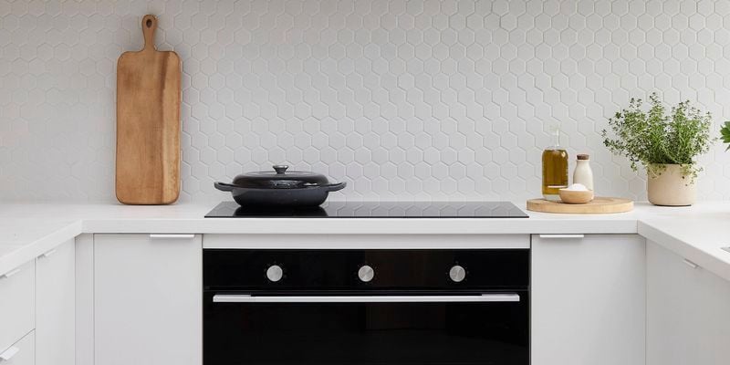 Black oven displayed in modern kitchen display