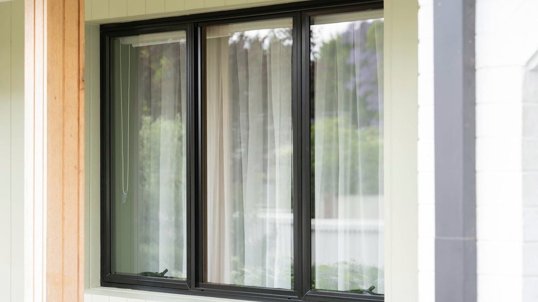 A clean glass window with black frame