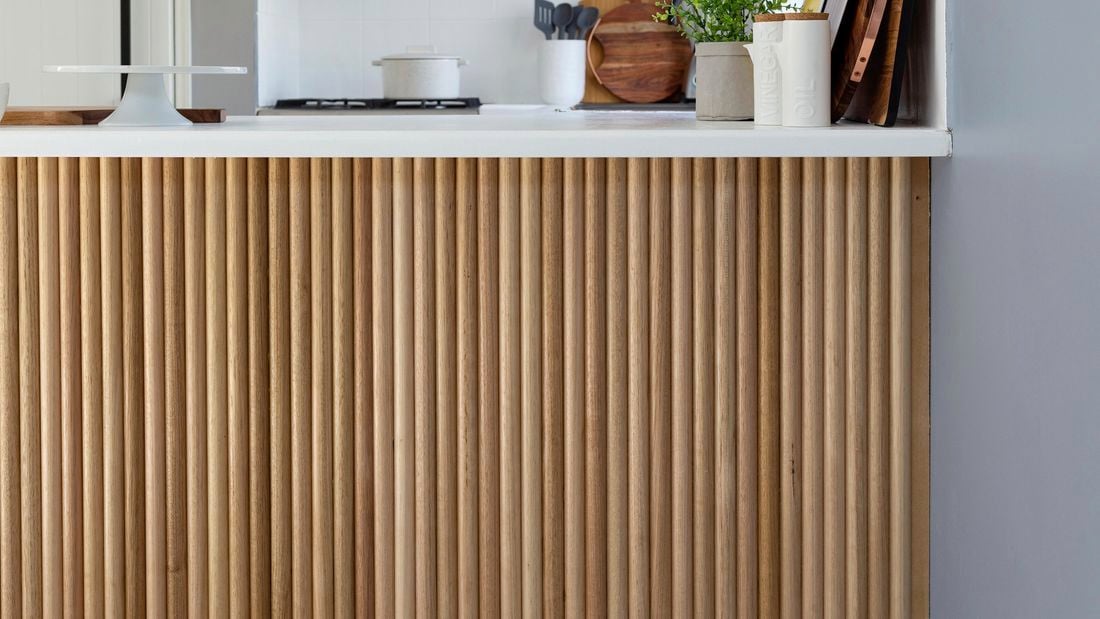 Dowel timber feature underneath kitchen bench.