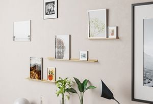 Various wall prints on the wall and also located on some photo shelves.