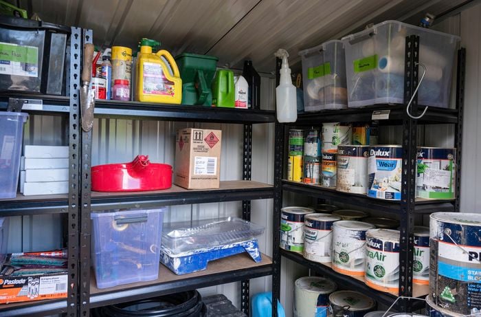 Various products on shelves in a shed.