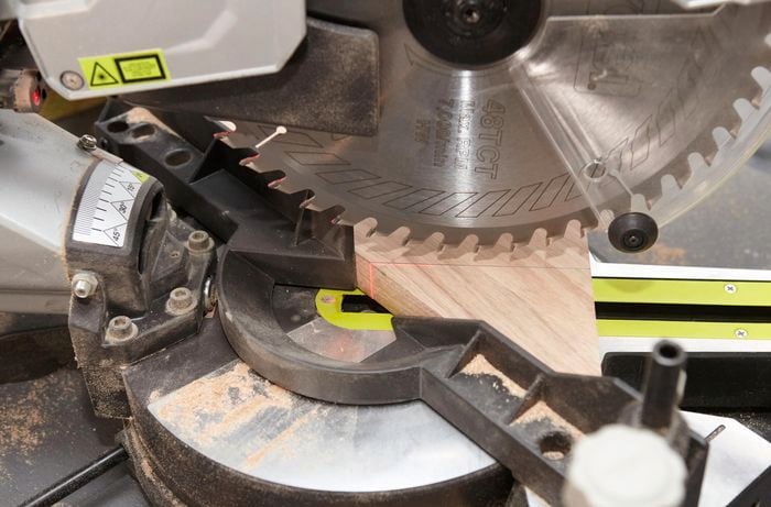 A circular saw in position over a piece of timber ready for cutting