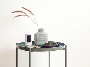 Ring Stick Up Cam on a green side table