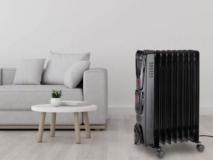 Arlec 2000W 9 Fin Oil Heater in a living room