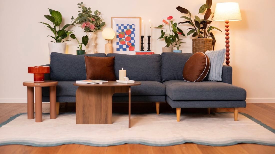 The shelf is styled with a mix of practical and decorative items to make the space feel warm and organised. 