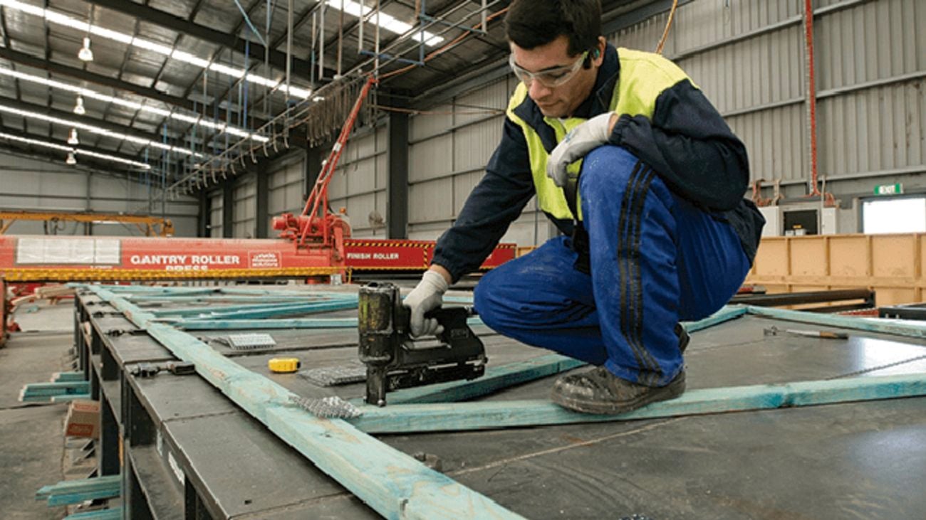 a person in a workplace wearing protective gear