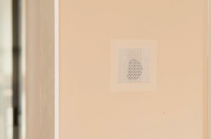 wire patch is placed over the hole