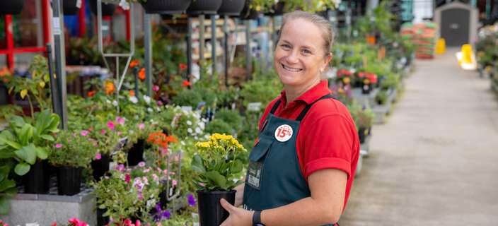A Bunnings Team Member and a customer in a Nursery in a Bunnings store.