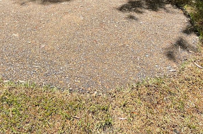 A round patch is cleared from a lawn area