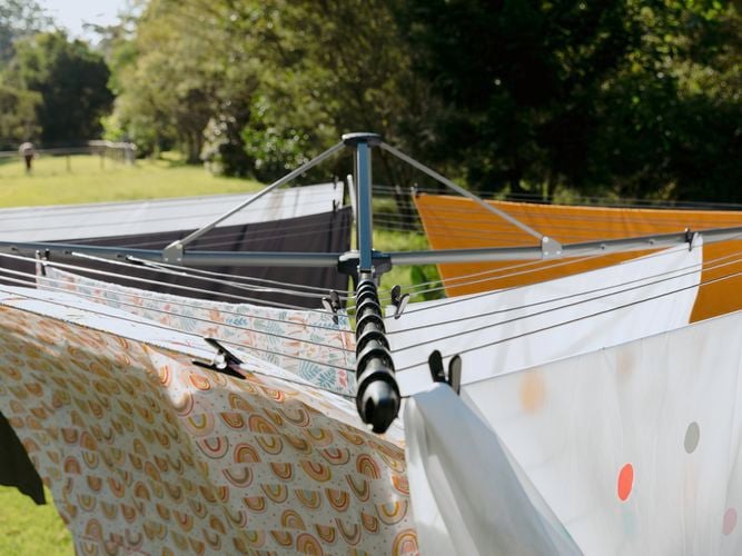 Hills Large Rotary Clothesline with clothes hanging on it.