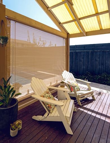 Outdoor timber decking area with blinds