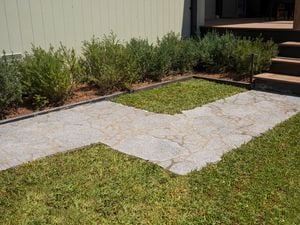 Final paved tile pathway leading up to the front entrance. 
