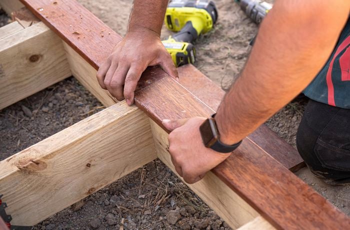 Decking boards being laid into place