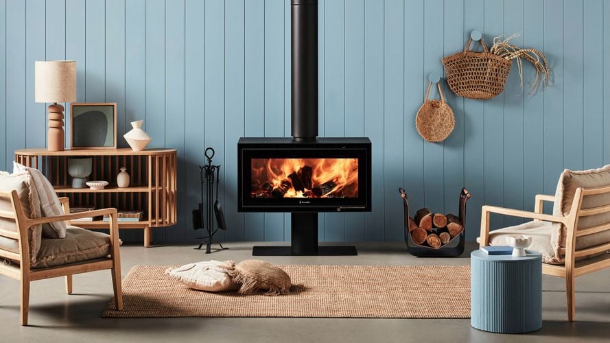 Indoor wood heater in a styled living room.