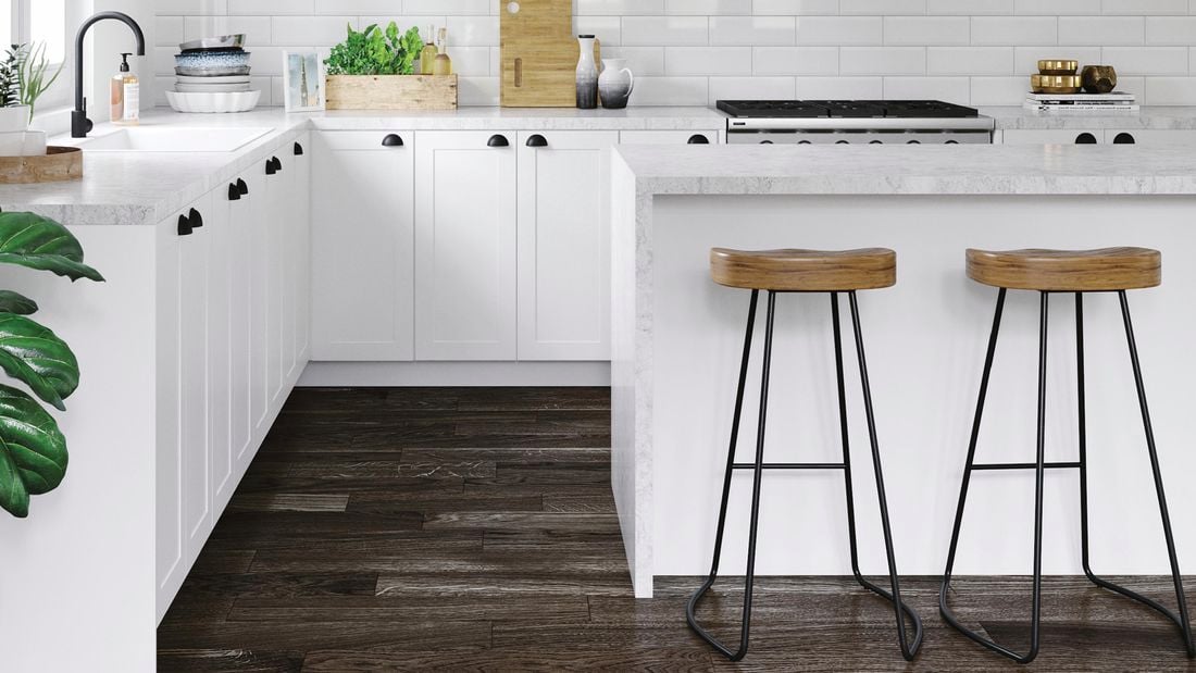 Kitchen with white benchtops, marble benchtop and white tile splashback.