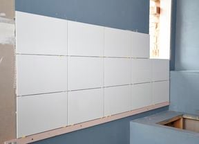 DIY Step Image - How to tile a bathroom wall . Blob storage upload.