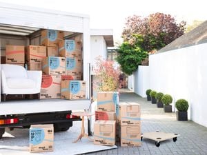 Removal truck full of packing boxes and furniture
