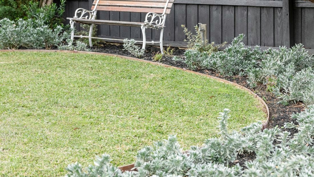 Fence, outdoor bench and lawn.