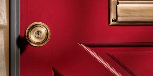 Close up of a standard door lock on a red front door