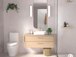 A bathroom with a sink on top of a wooden cabinet, a mirror on the wall and a toilet