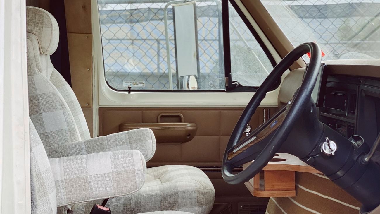 A custom RV caravan front seat area.