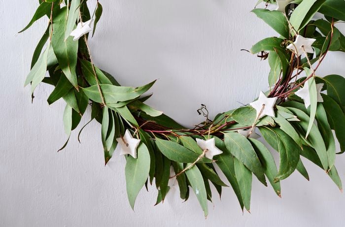 Christmas wreath made from eucalyptus leaves with clay star decorations 