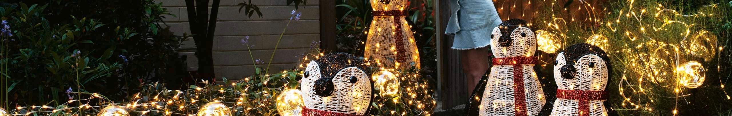 Penguins with lights in it outside