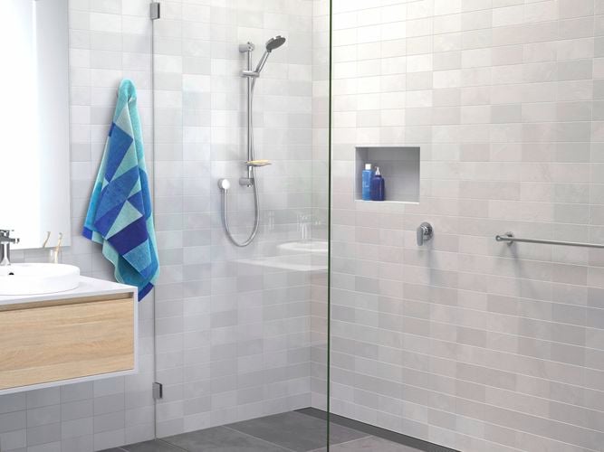 Chrome flexispray shower head with blue towel