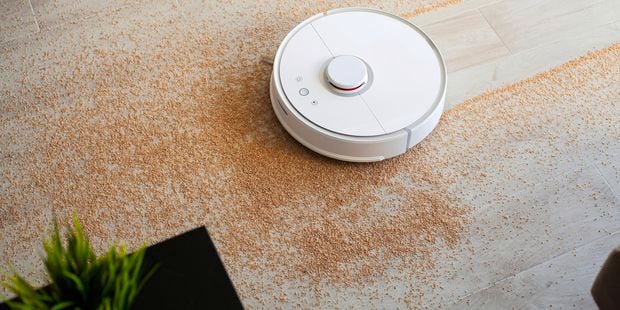 Robotic vacuum cleaning over a spilled mess.