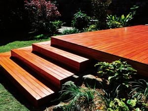 Shot of wooden stairs coated with finish, sun shining on them.