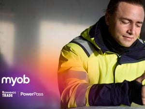 Tradie on MYOB app on his phone.