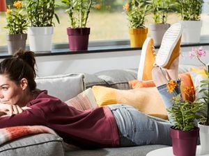 Person lying on couch.