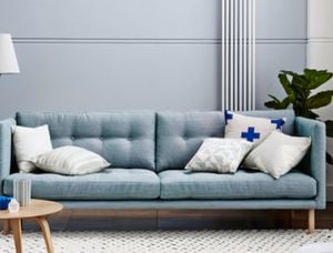 Light blue couch against a similar blue coloured wall