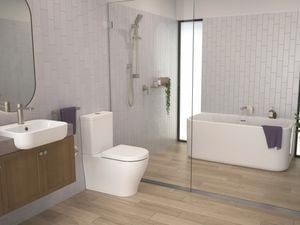 Modern bathroom with timber floor and white bath, basin and toilet