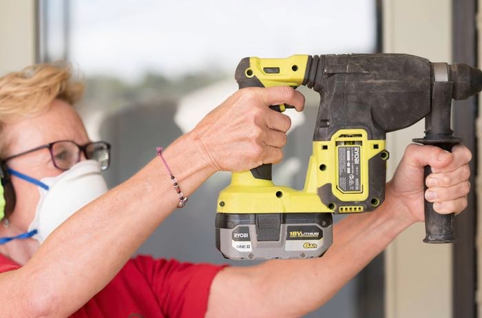 Start drilling into brick wall using a Ryobi rotary hammer