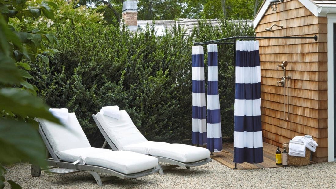 Outdoor shower and lounge chairs.