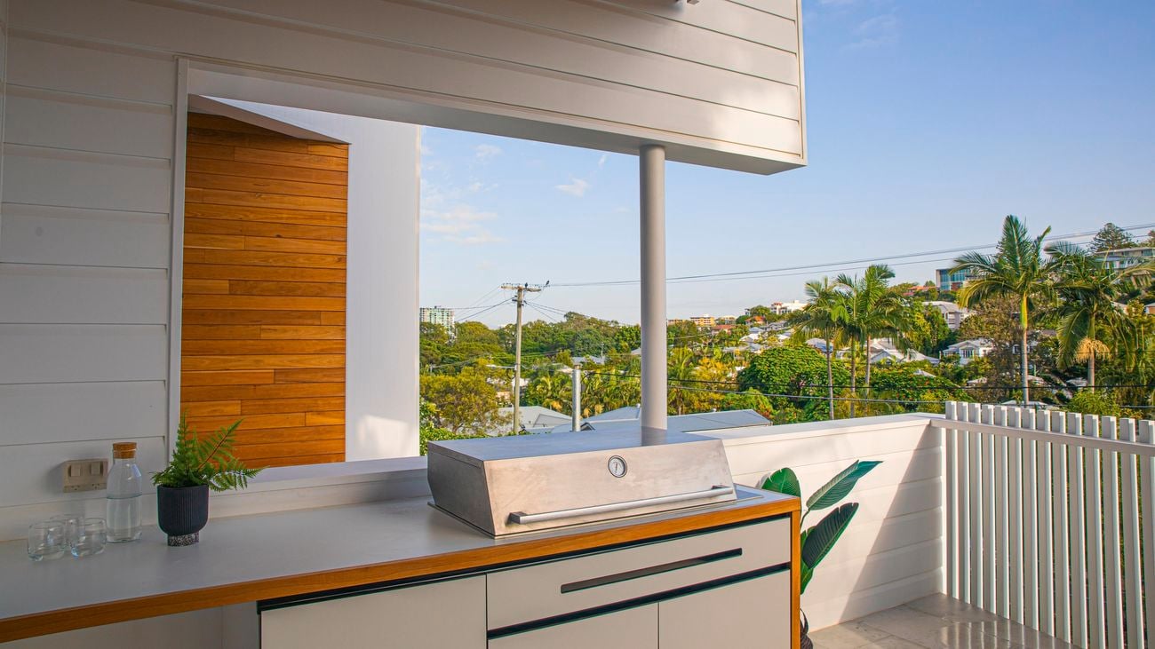 Alfresco kitchen featuring a cabinetry, benchtop and a barbecue