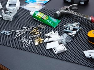 A hammer, fasteners and fixings