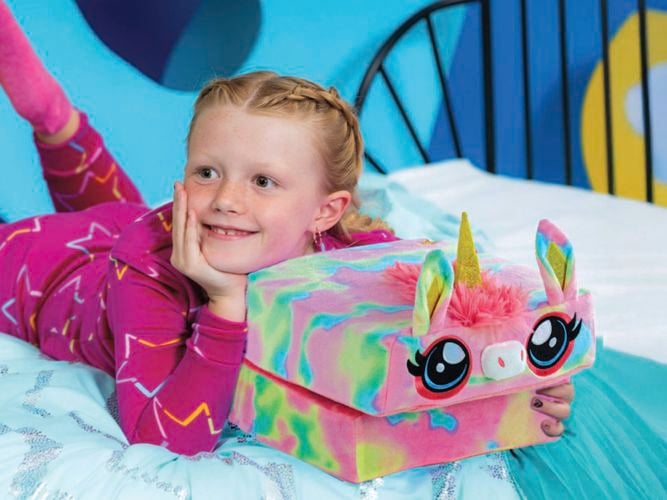 A girl with a pillow cube, these are playful pals by day and a cosy, comfy pillow by night! These huggable, squeezable toys spark imagination and fun during playtime, then unfold into a full-size pillow for naps or bedtime. 