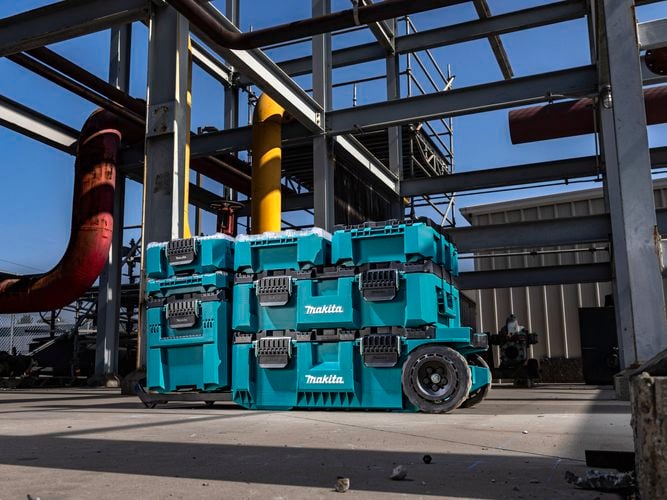 Maktrak storage with wheels on an industrial work site.