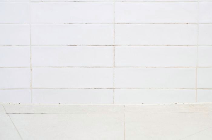 : Identify problem areas like bathroom grout and tiles for mould