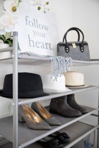 Shoe rack with shoes and hats